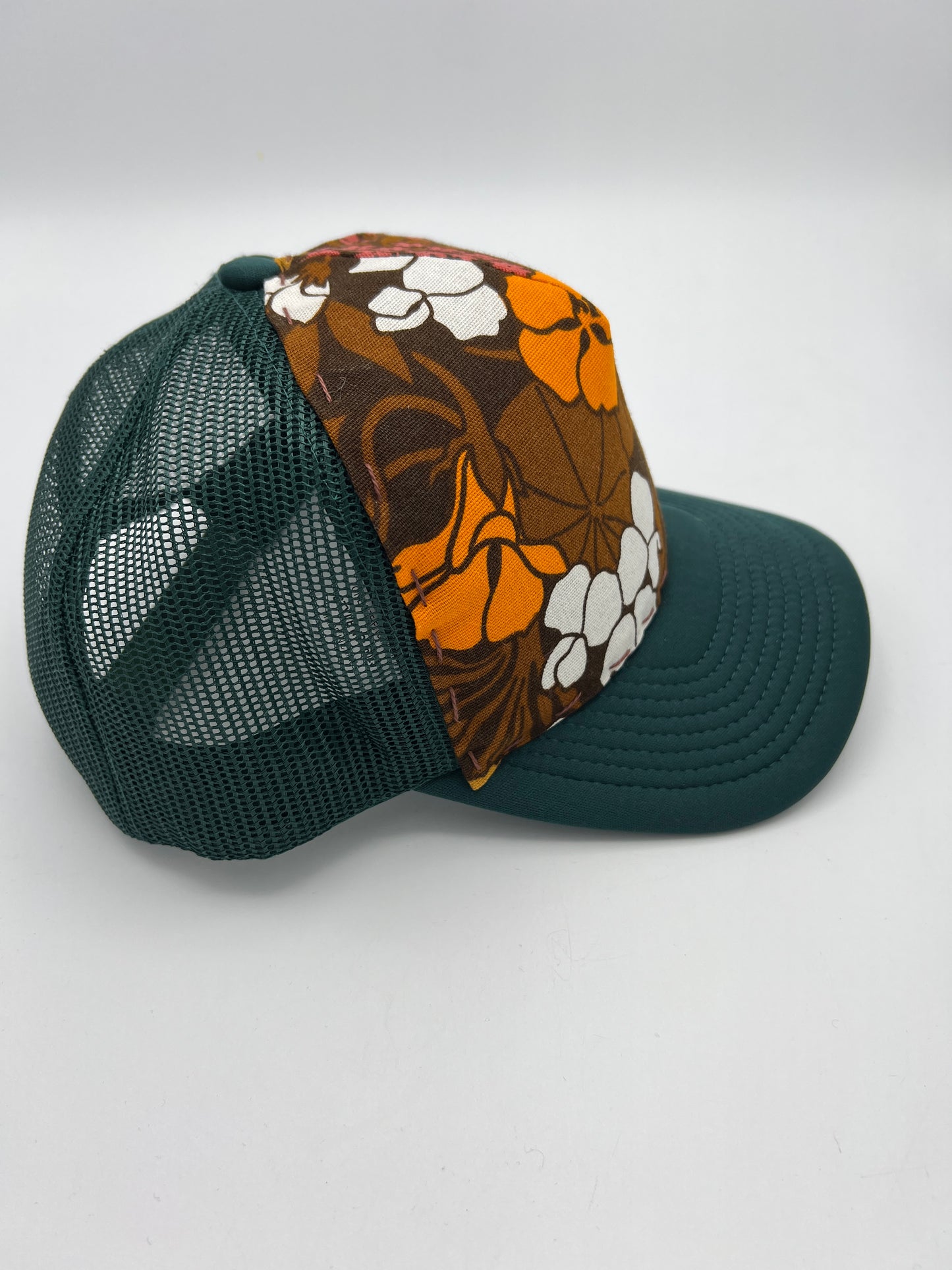 Vivid vintage aloha fabric- forest green curved brim trucker hat