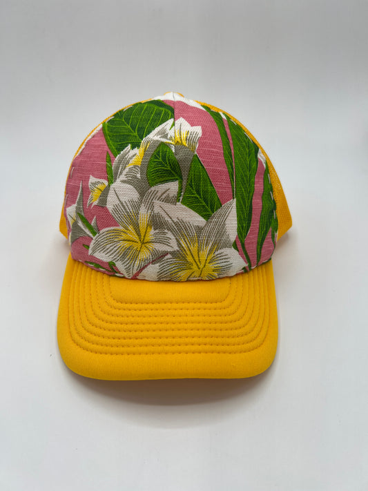 Bagshaws of Saint Lucia vibrant plumeria vintage fabric- yellow curved brim trucker hat