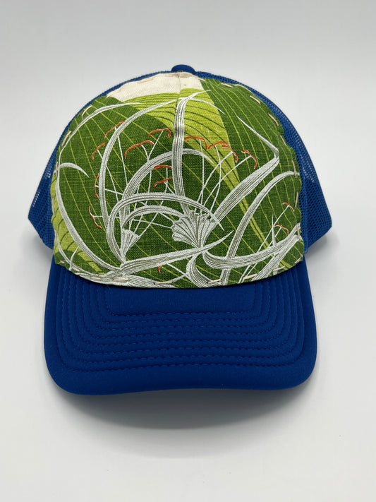 Bagshaws of Saint Lucia vibrant vintage spider lily fabric- blue curved brim trucker hat