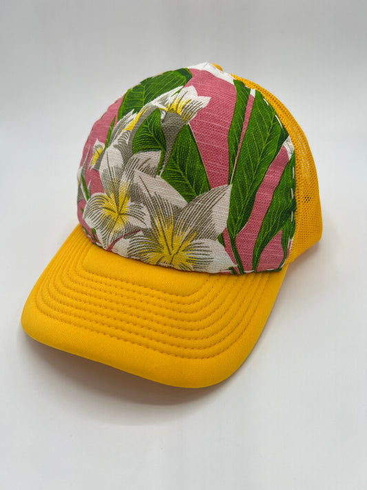 Bagshaws of Saint Lucia vibrant plumeria vintage fabric- yellow curved brim trucker hat