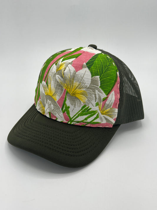 Bagshaws of Saint Lucia vibrant plumeria vintage fabric- army green curved brim trucker hat