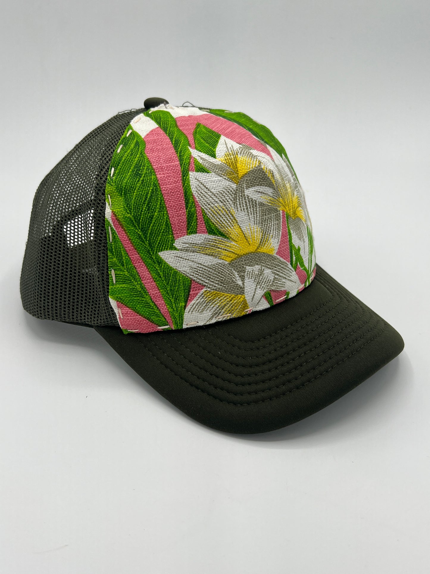 Bagshaws of Saint Lucia vibrant plumeria vintage fabric- army green curved brim trucker hat